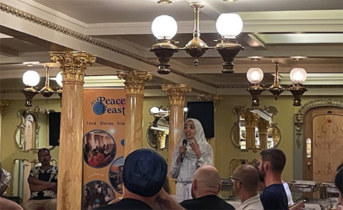 St Peter's team member speaking at Peace Feast