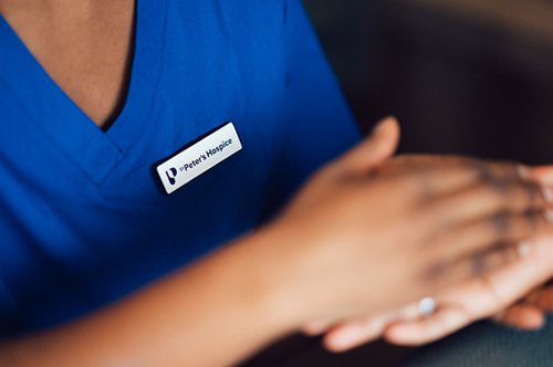 Inpatient Unit nurse holding hands with a patient
