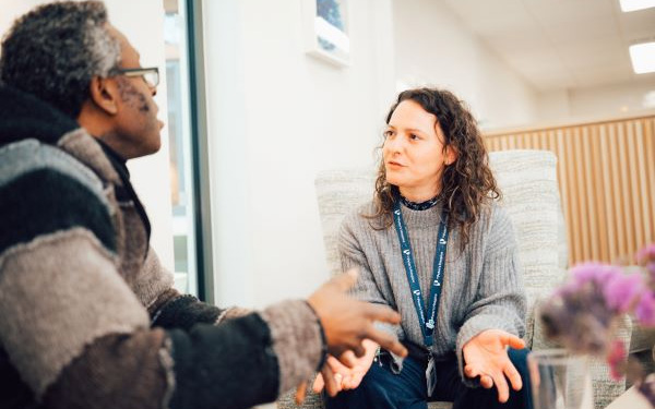 Social worker talking to a family member